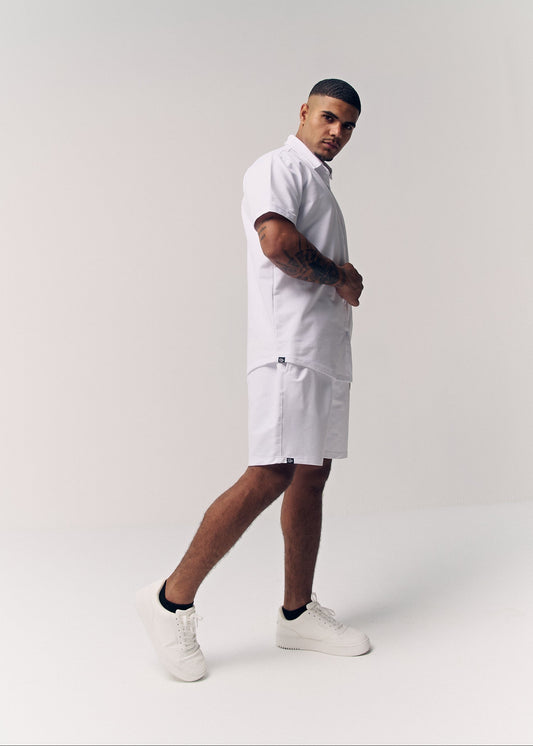 White Classix regular fit shorts for men, side view on model – Rewind Apparel Dubai