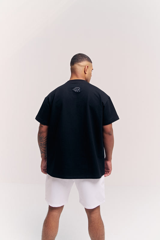 Flawless Classix t-shirt and shorts set for men, black oversized tee with white shorts, back view – Rewind Apparel Dubai
