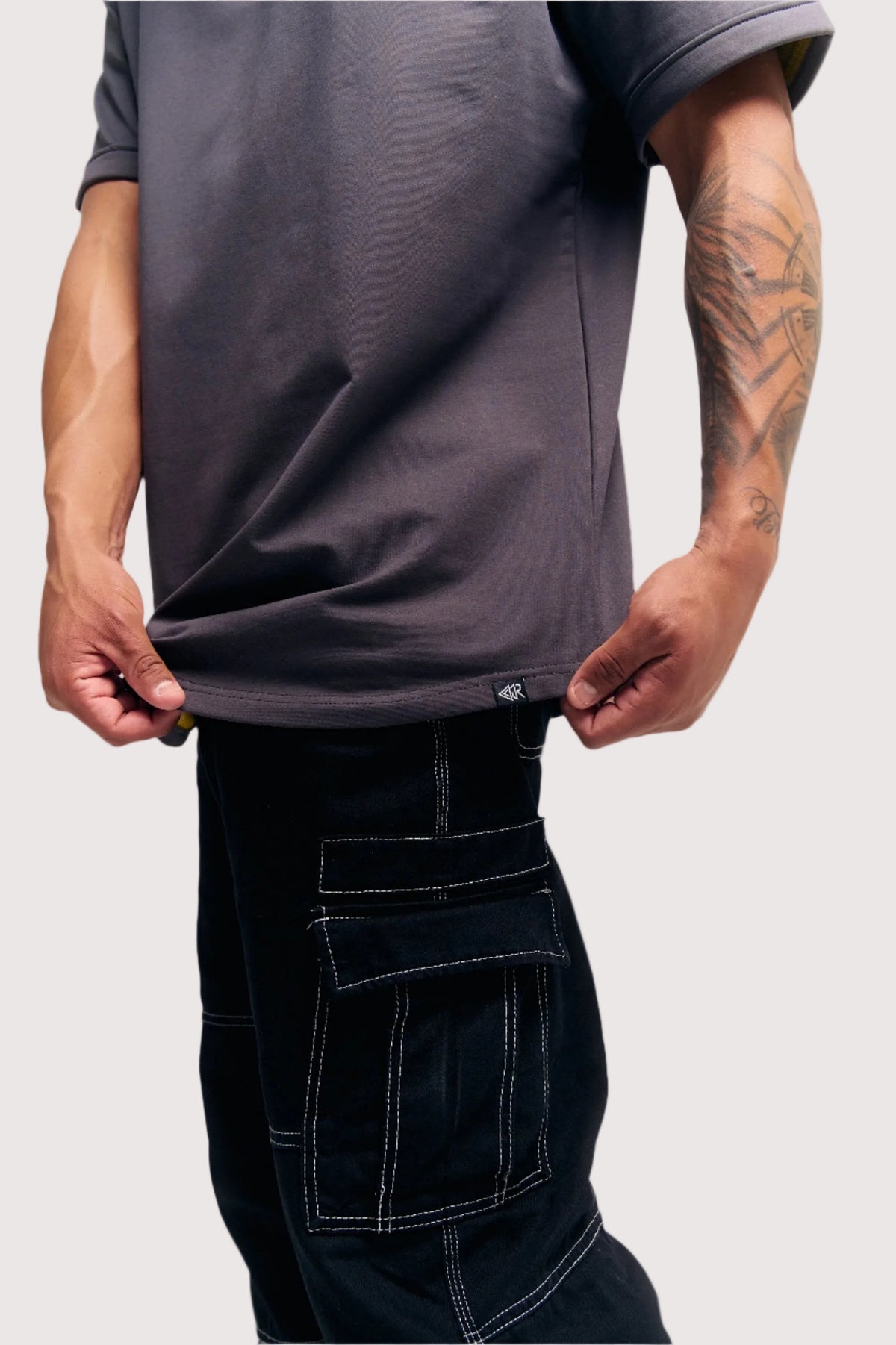 Dark Grey Eternal relaxed fit t-shirt for men, hem and woven label close-up – Rewind Apparel Dubai