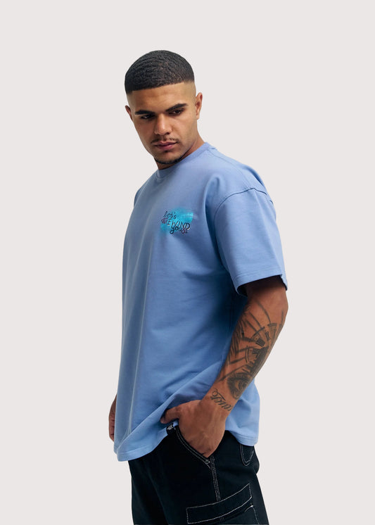 Blue Rewind x Koko's Art oversized graphic t-shirt for men, front view on model – Rewind Apparel Dubai