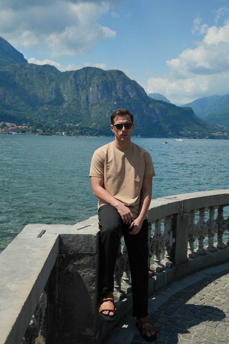 Man wearing Rewind Apparel at Lake Como, europe summer packing guide, travel lookbook