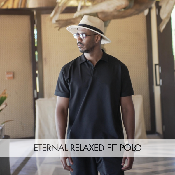 Man wearing an Eternal Relaxed Fit Polo shirt, showcasing comfort and style in a modern setting, perfect for various occasions.