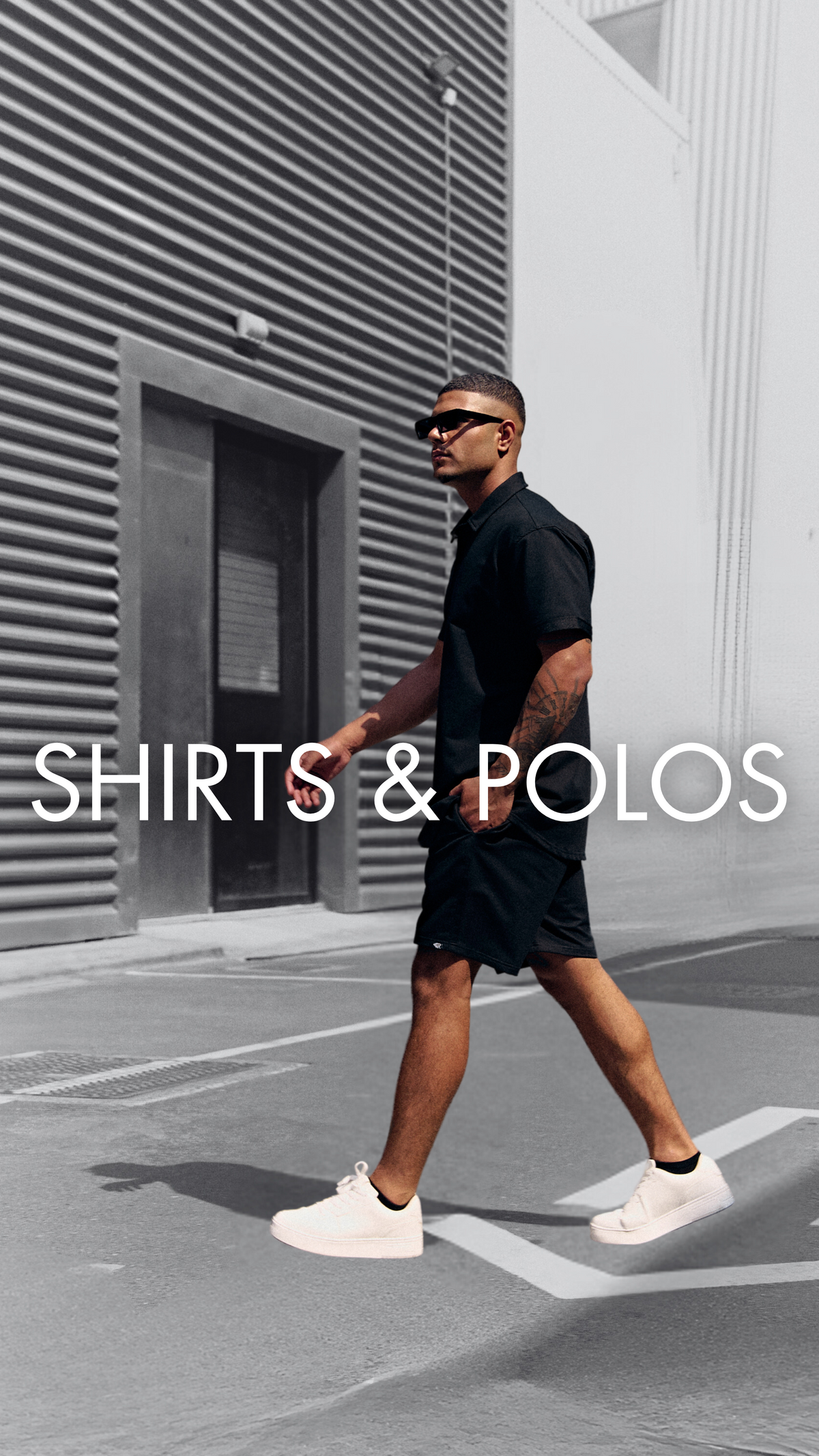 Man walking in a black Prime button-up shirt – men's polo shirts and shirts by Rewind Apparel Dubai