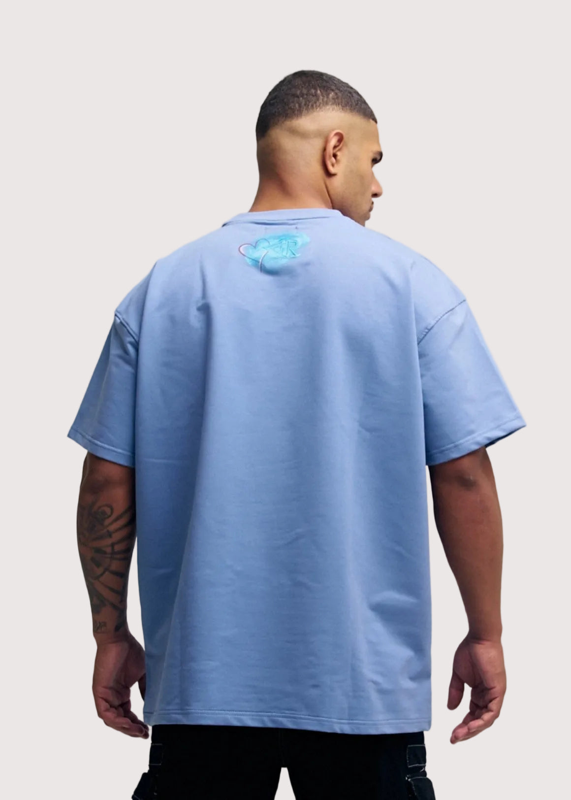 Blue Rewind x Koko's Art oversized graphic t-shirt for men, back view with artwork, close crop – Rewind Apparel Dubai